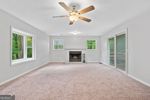 3047 Hudson Ct, Decatur, GA 30033 - unfurnished living room featuring a fireplace with flush hearth, a ceiling fan, and carpet flooring