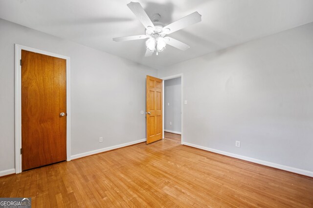 3047 Hudson Ct, Decatur, GA 30033 - unfurnished bedroom featuring wood finished floors and a ceiling fan
