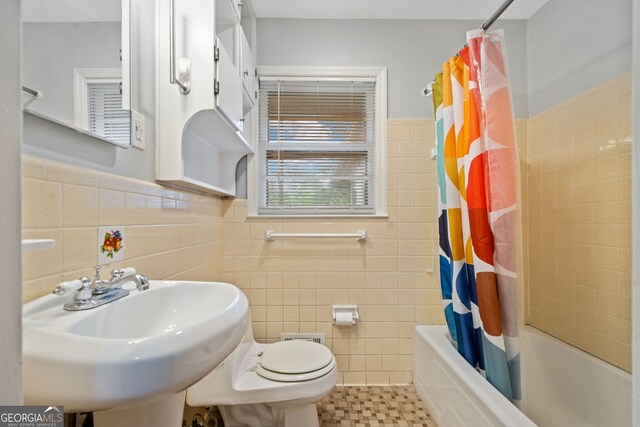 3047 Hudson Ct, Decatur, GA 30033 - full bath featuring tile walls, shower / bath combo with shower curtain, tile patterned floors, and wainscoting
