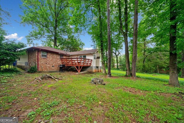 3047 Hudson Ct, Decatur, GA 30033 - view of grassy yard featuring a wooden deck