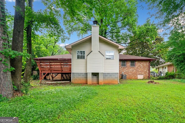 3047 Hudson Ct, Decatur, GA 30033 - back of property featuring a wooden deck, a yard, and a chimney