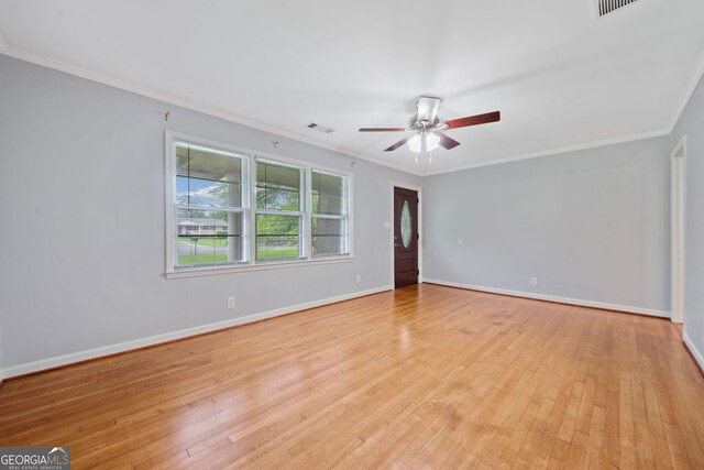 3047 Hudson Ct, Decatur, GA 30033 - empty room featuring light wood-style flooring, a ceiling fan, and ornamental molding