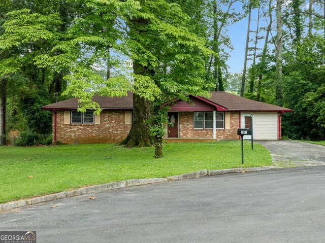 3047 Hudson Ct, Decatur, GA 30033 - ranch-style home featuring asphalt driveway, a front lawn, brick siding, an attached garage, and a shingled roof