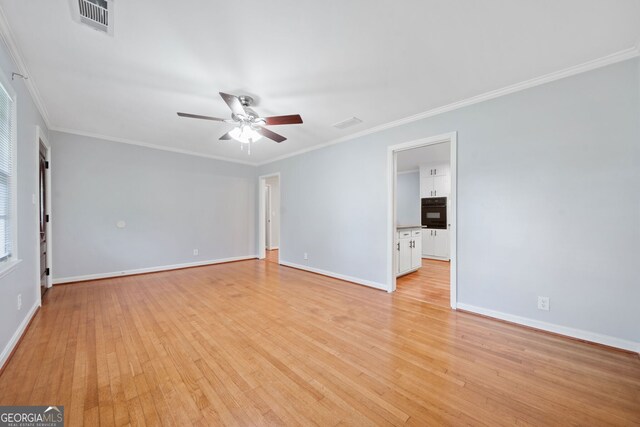 3047 Hudson Ct, Decatur, GA 30033 - spare room with ceiling fan, light wood-style flooring, and ornamental molding