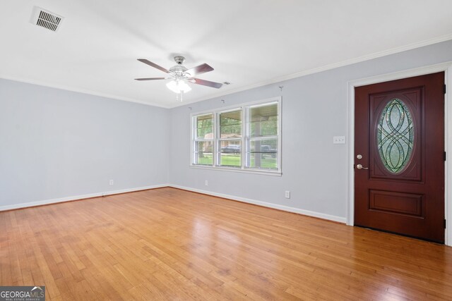 3047 Hudson Ct, Decatur, GA 30033 - foyer entrance with a ceiling fan, light wood finished floors, and ornamental molding