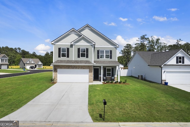 22 Mossy Oaks Ln NE, Rome, GA 30165 - craftsman house featuring driveway, a front yard, an attached garage, and a porch