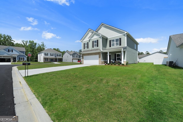 22 Mossy Oaks Ln NE, Rome, GA 30165 - view of front facade featuring concrete driveway, a front lawn, a garage, a residential view, and covered porch
