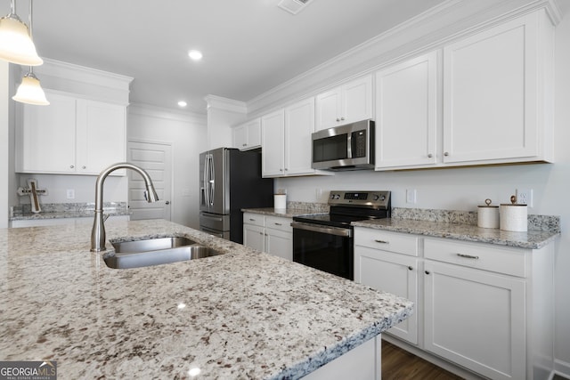 22 Mossy Oaks Ln NE, Rome, GA 30165 - kitchen with appliances with stainless steel finishes, white cabinetry, crown molding, recessed lighting, and light stone countertops