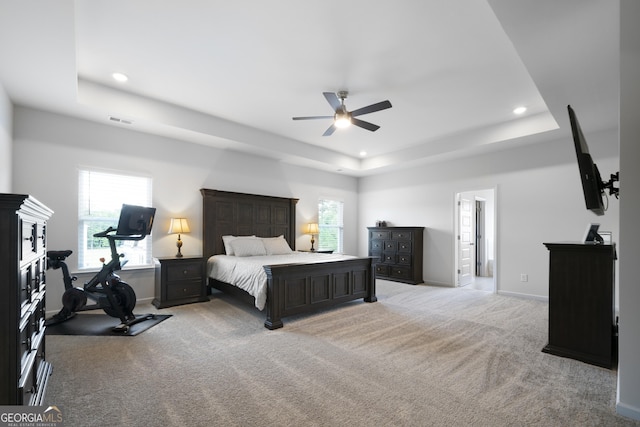 22 Mossy Oaks Ln NE, Rome, GA 30165 - bedroom featuring a tray ceiling, multiple windows, light colored carpet, recessed lighting, and ceiling fan