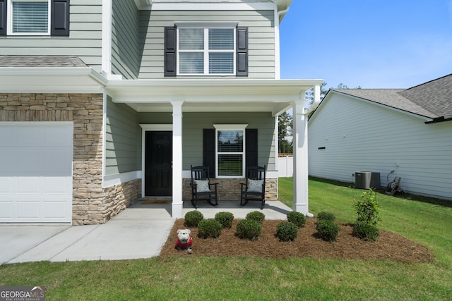 22 Mossy Oaks Ln NE, Rome, GA 30165 - property entrance featuring covered porch, stone siding, and a lawn