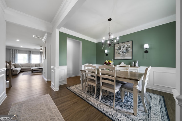 22 Mossy Oaks Ln NE, Rome, GA 30165 - dining room featuring ornamental molding, dark wood finished floors, wainscoting, a chandelier, and a decorative wall