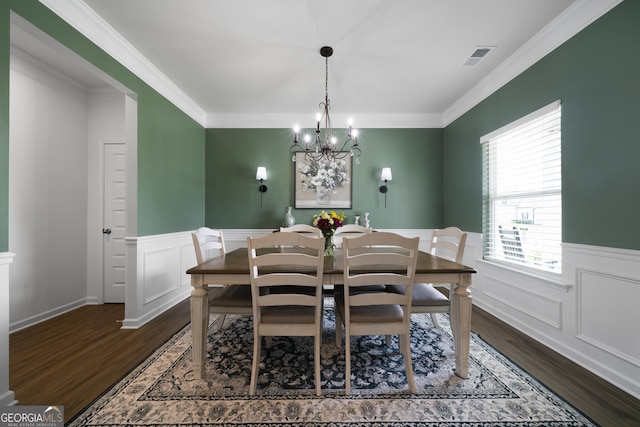 22 Mossy Oaks Ln NE, Rome, GA 30165 - dining space with dark wood-type flooring, a wainscoted wall, a chandelier, ornamental molding, and a decorative wall