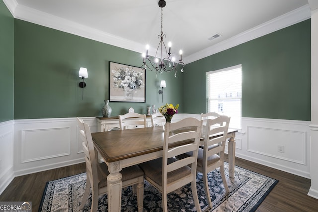 22 Mossy Oaks Ln NE, Rome, GA 30165 - dining room with wainscoting, dark wood-style flooring, a chandelier, ornamental molding, and a decorative wall