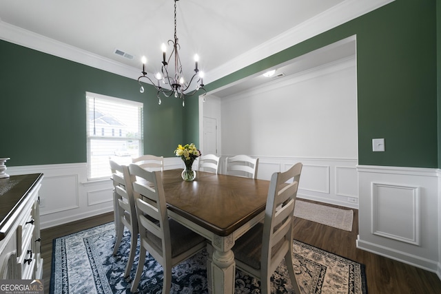 22 Mossy Oaks Ln NE, Rome, GA 30165 - dining area featuring a chandelier, crown molding, a wainscoted wall, dark wood-style flooring, and a decorative wall