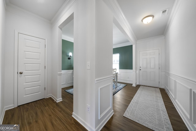 22 Mossy Oaks Ln NE, Rome, GA 30165 - entrance foyer with dark wood-type flooring, ornamental molding, a wainscoted wall, and a decorative wall
