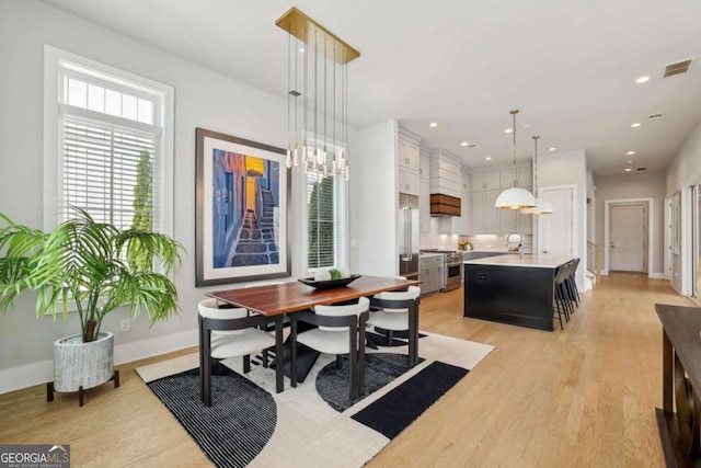 6815 Halcyon Way, Alpharetta, GA 30005 - dining space featuring light wood finished floors, baseboards, and recessed lighting