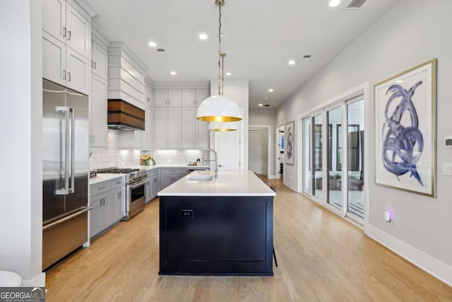 6815 Halcyon Way, Alpharetta, GA 30005 - kitchen with high end appliances, a sink, light wood-type flooring, backsplash, and recessed lighting