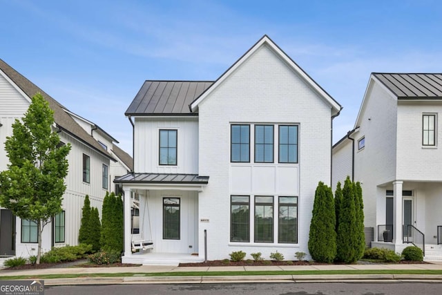 6815 Halcyon Way, Alpharetta, GA 30005 - modern inspired farmhouse featuring a standing seam roof and metal roof