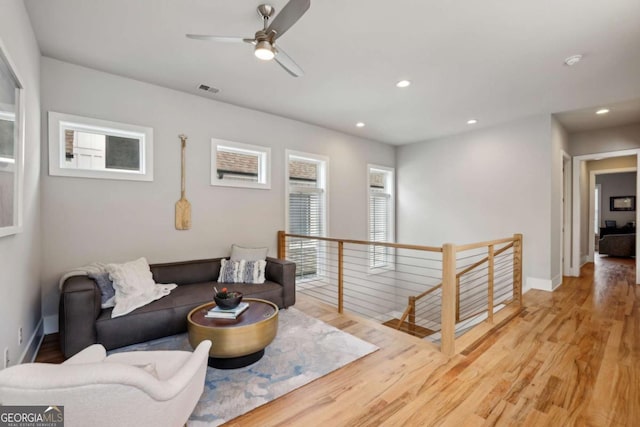 6815 Halcyon Way, Alpharetta, GA 30005 - sitting room featuring an upstairs landing, light wood-style flooring, recessed lighting, a ceiling fan, and baseboards
