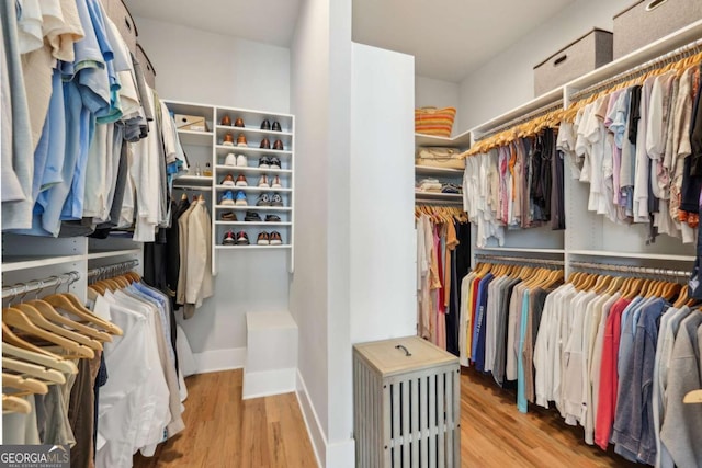 6815 Halcyon Way, Alpharetta, GA 30005 - spacious closet featuring wood finished floors