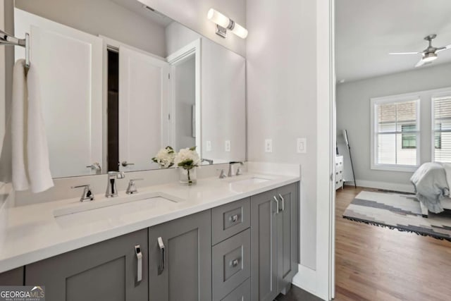 6815 Halcyon Way, Alpharetta, GA 30005 - full bath featuring double vanity, ensuite bathroom, wood finished floors, ceiling fan, and baseboards