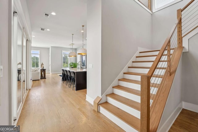 6815 Halcyon Way, Alpharetta, GA 30005 - staircase featuring wood finished floors, baseboards, and recessed lighting