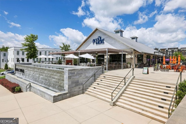 6815 Halcyon Way, Alpharetta, GA 30005 - view of home's community with a patio area
