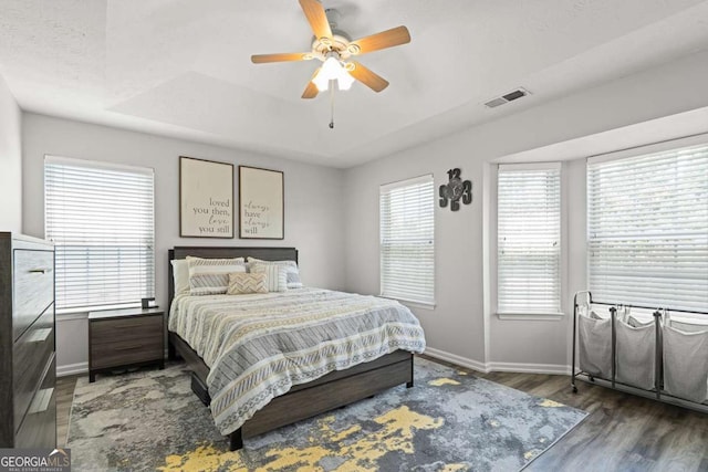2061 Pinnacle Pointe Dr, Norcross, GA 30071 - bedroom with baseboards, wood finished floors, ceiling fan, and a raised ceiling