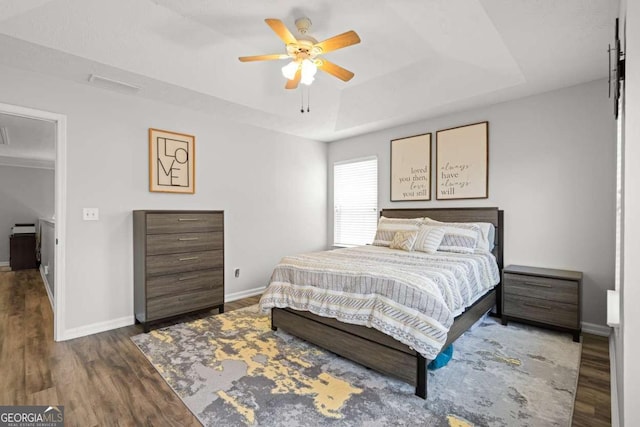 2061 Pinnacle Pointe Dr, Norcross, GA 30071 - bedroom featuring a raised ceiling, wood finished floors, baseboards, and a ceiling fan