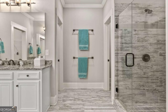 505 Parkview Dr, Milton, GA 30004 - bathroom with ornamental molding, a shower stall, vanity, and baseboards