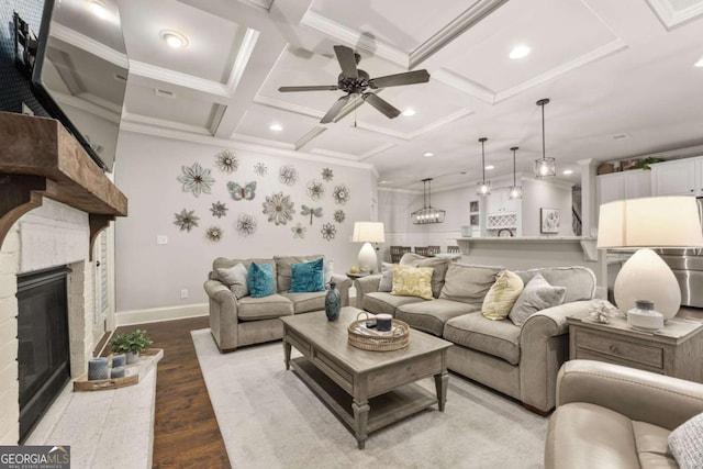 505 Parkview Dr, Milton, GA 30004 - living area with wood finished floors, coffered ceiling, ceiling fan, a fireplace, and crown molding