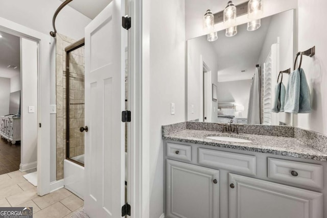 505 Parkview Dr, Milton, GA 30004 - full bath with vanity, shower / bath combination with glass door, tile patterned flooring, and ensuite bathroom