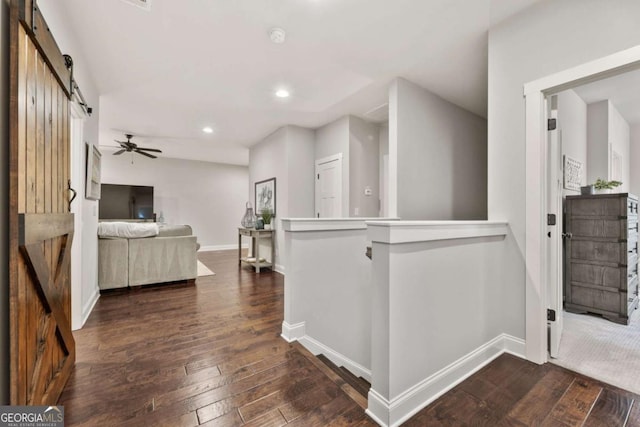 505 Parkview Dr, Milton, GA 30004 - hall with a barn door, dark wood-type flooring, baseboards, recessed lighting, and an upstairs landing
