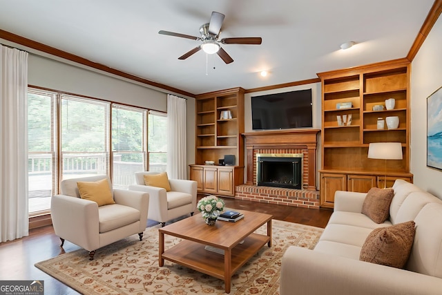 214 Jamestown Ave, Jonesboro, GA 30236 - living area with ceiling fan, dark wood finished floors, a brick fireplace, and crown molding