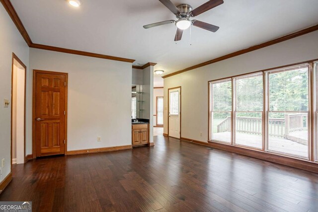 214 Jamestown Ave, Jonesboro, GA 30236 - unfurnished living room with crown molding, dark wood-style flooring, and a ceiling fan
