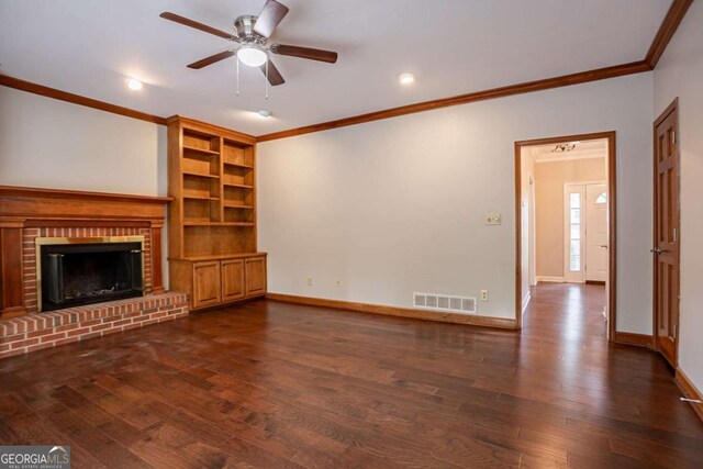 214 Jamestown Ave, Jonesboro, GA 30236 - unfurnished living room with ornamental molding, dark wood-style flooring, a ceiling fan, a brick fireplace, and recessed lighting