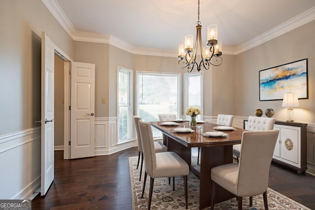 214 Jamestown Ave, Jonesboro, GA 30236 - dining area featuring a chandelier, ornamental molding, dark wood-style floors, wainscoting, and a decorative wall