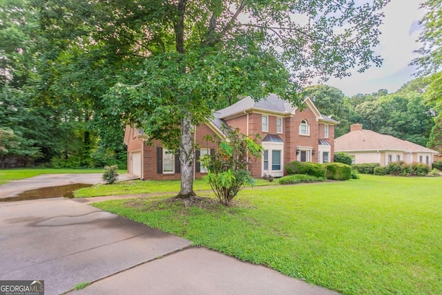 214 Jamestown Ave, Jonesboro, GA 30236 - view of front facade featuring brick siding, concrete driveway, and a front lawn