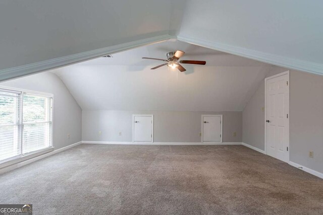 214 Jamestown Ave, Jonesboro, GA 30236 - bonus room with lofted ceiling, ceiling fan, and carpet flooring