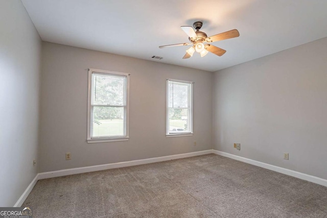 214 Jamestown Ave, Jonesboro, GA 30236 - carpeted empty room with a ceiling fan and baseboards