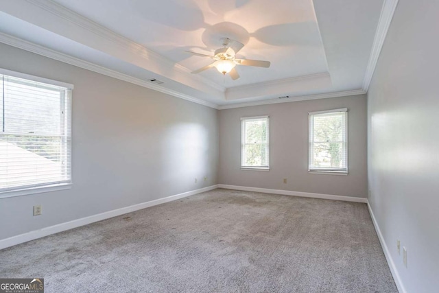 214 Jamestown Ave, Jonesboro, GA 30236 - carpeted empty room featuring a raised ceiling, crown molding, and ceiling fan