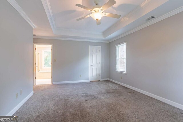 214 Jamestown Ave, Jonesboro, GA 30236 - empty room with a tray ceiling, carpet, ornamental molding, and ceiling fan