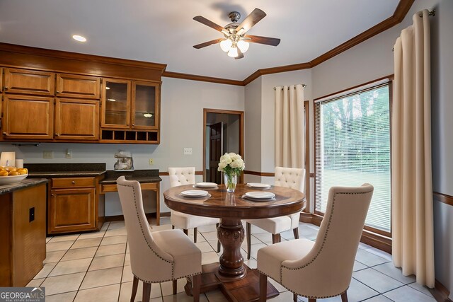 214 Jamestown Ave, Jonesboro, GA 30236 - dining area with light tile patterned floors, a ceiling fan, and crown molding