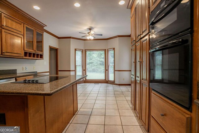 214 Jamestown Ave, Jonesboro, GA 30236 - kitchen featuring brown cabinetry, a ceiling fan, black electric stovetop, light tile patterned floors, and recessed lighting