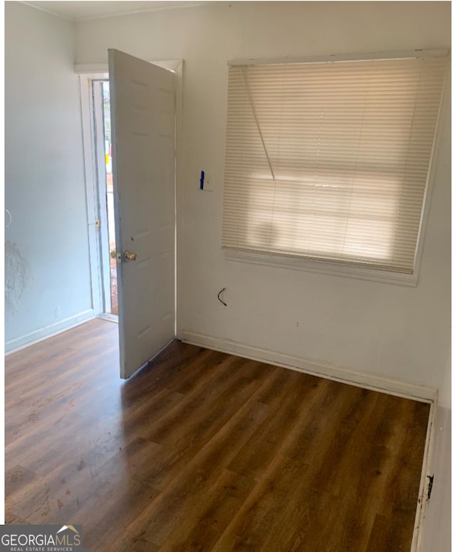 1129 Windsor St SW, Atlanta, GA 30310 - empty room with dark wood finished floors and baseboards