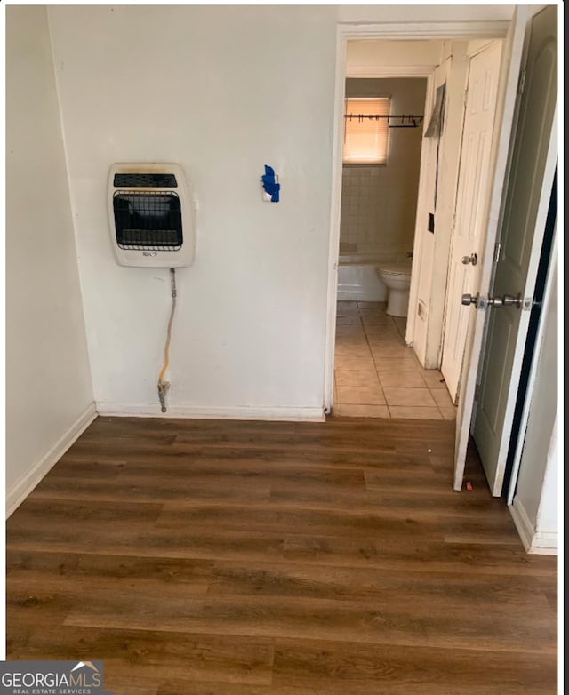1129 Windsor St SW, Atlanta, GA 30310 - hallway with heating unit, wood finished floors, and baseboards
