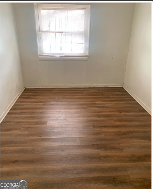 1129 Windsor St SW, Atlanta, GA 30310 - spare room featuring wood finished floors and baseboards