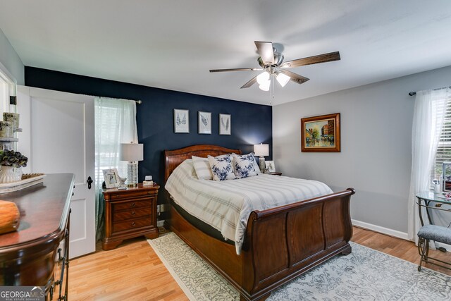 75 Barber Rd, Carrollton, GA 30116 - bedroom featuring light wood-type flooring, ceiling fan, and baseboards