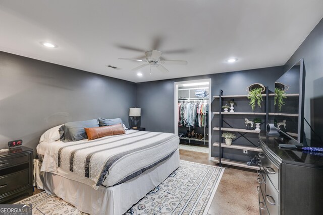 75 Barber Rd, Carrollton, GA 30116 - bedroom featuring a walk in closet, a closet, recessed lighting, a ceiling fan, and light carpet