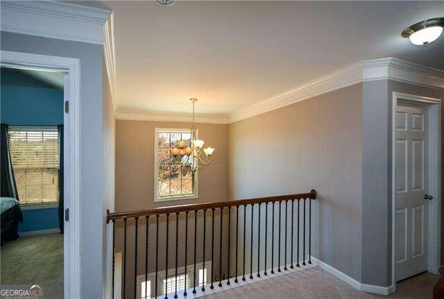 1480 Waverly Glen Dr, Alpharetta, GA 30004 - hallway featuring carpet floors, plenty of natural light, a chandelier, and ornamental molding